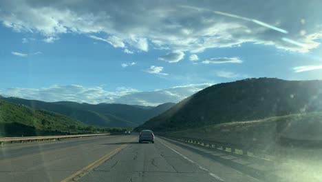 POV-view-driving-on-the-highway-70,-in-middle-of-Plumas-national-forest,-in-sunny-California