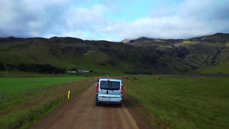 Driving-on-an-open-dirt-road-in-Seljavallalaug,-Iceland--Aerial