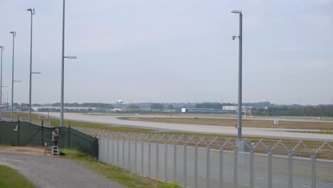 Lufthansa-Regional-airplane-landing-at-Frankfurt-Airport,-Germany-on-a-cloudy-day