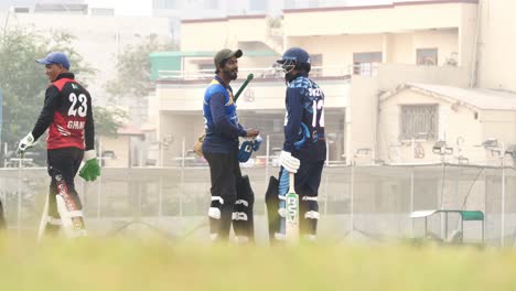 Cricketers-Walking-Past-Players-On-field