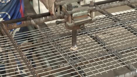 Wire-Mesh-Frame-Being-Moved-Under-Arm-Of-Spot-Welding-Machine-In-Karachi-Steel-Factory