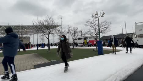 Toronto-Harbourfront-skating-during-winter---January-2022---Skating-in-urban-city-during-winter-in-Ontario,-Canada-on-new-years-near-waterfront