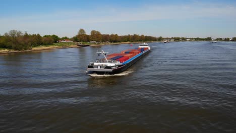 Aerial-View-Of-Cornelis-R-Cargo-Ship-Approaching-Along-Oude-Maas-On-18-April-2022