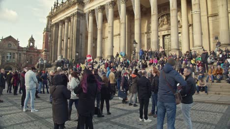 Large-crowd-of-extinction-rebellion-protesters-outside-town-hall-in-city-center-demonstrating-about-NHS-working-conditions-and-say-no-to-vaccine-passports