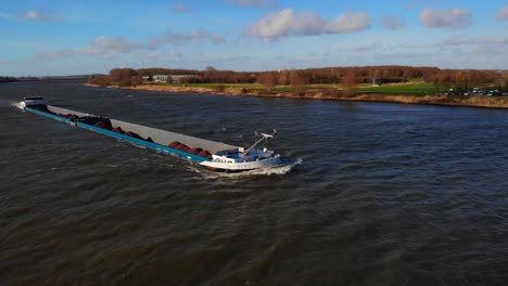 Aerial-Starboard-And-Forward-Bow-Of-Sjouwer-Cargo-Ship-Navigating-Along-Oude-Maas