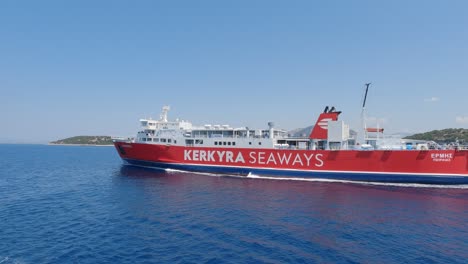 Ferryboats-cruising-on-mediterranean-sea,-Red-painted-Ferryboat-passing-by,-Greek-Island-transportation