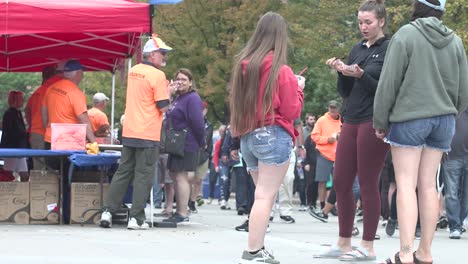 Taste-of-Madison-Man-with-Shorts-walking-by-and-Girls-Standing