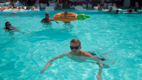 Young-caucasian-man-swimming-blue-water-in-a-pool