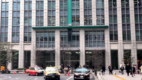 People,-car-and-bus-at-the-Nihonbashi-entrance-exit-of-Tokyo-Station