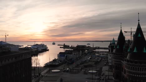 Aerial-of-central-Helsingborg,-Sweden-during-a-winter-sunset