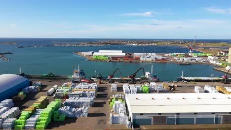 Aerial-view-of-ship-being-loaded-by-cranes-in-industry-harbour