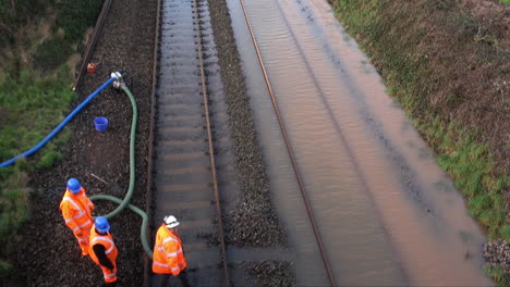 UK-February-2014---Flood-water-is-pumped-off-a-railway-track-by-Network-Rail-workers-during-the-Somerset-Levels-floods