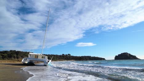 Stranded-catamaran-on-sand-beach