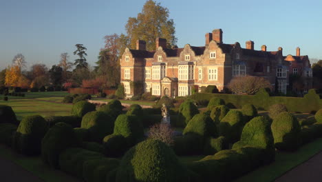 Aerial-view-of-rising-over-Godinton-House-and-gardens,-Ashford,-Kent,-UK