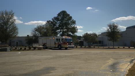 Fire-rescue-truck-drives-into-a-driveway-to-respond-to-an-emergency