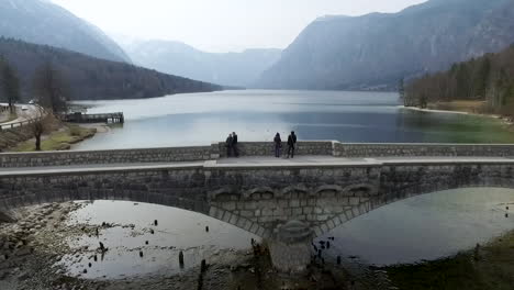 Flying-forward-over-the-bridge-from-the-Bohinj-lake,-Slovenia