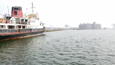 rusting-old-ferry-sits-docked-Rundown-and-derelict-on-dockland-waterfront-abandoned