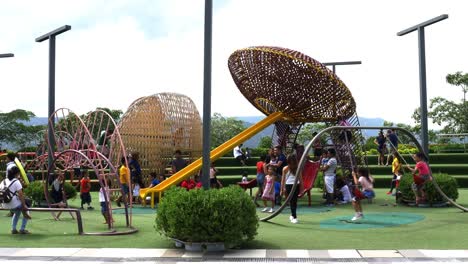 Supervised-by-parents-and-guardians,-frolicking-young-kids-explore-the-playground-attractions-at-SM-Seaside-Mall-on-South-Road-Properties,-Cebu-City,-Philippines