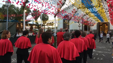 Christian-Religious-Festive-Celebration-procession-in-honor-of-saint-John-The-Baptist,-men-carry-the-statue-and-houndreds-of-people-walk-while-praying