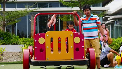 Supervised-by-parents-and-guardians,-frolicking-young-kids-explore-the-playground-attractions-at-SM-Seaside-Mall-on-South-Road-Properties,-Cebu-City,-Philippines