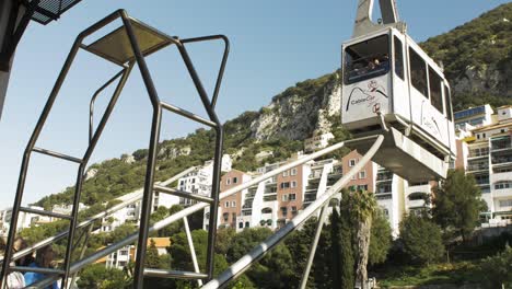 Cable-car-arriving-at-docking-station-in-Gibraltar,-United-Kingdom