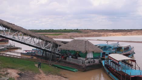 Pan-to-Tonle-Sap-Lake-Jetty-With-Commercial-Boats