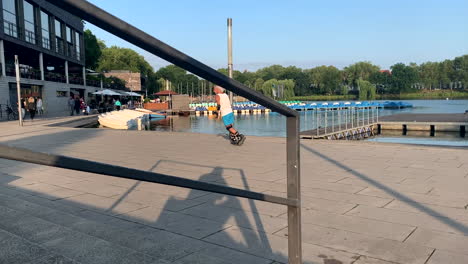 Old-Man-Rollerblading-On-The-Road-at-the-lake-on-a-beautiful-sunny-day