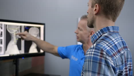 A-Chiropractor-explains-x-rays-to-a-patient