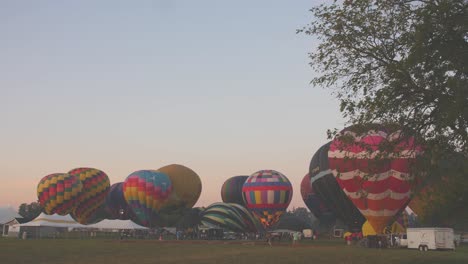 A-Time-Lapse-of-Hot-Air-Balloons-Filling-Up-at-a-Hot-Air-Balloon-Festival-on-a-Summer-Morning