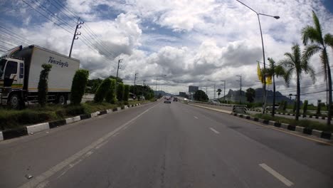 This-is-a-time-lapse-with-an-action-camera-mounted-in-front-of-the-truck,-driving-from-Pranburi-to-Hua-Hin-and-Hua-Hin-to-Bangkok-on-Phet-Kasem-Road