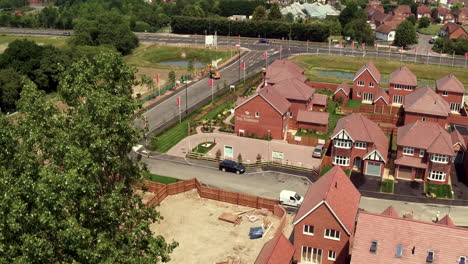 Aerial-rising-shot-from-Redrow-homes-development,-The-Fairways,-in-Herne-Bay,-Kent-revealing-the-coast