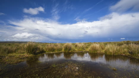 Time-Lapse-of-wind-turbines-with-dramatic-clouds-in-remote-landscape-of-Ireland