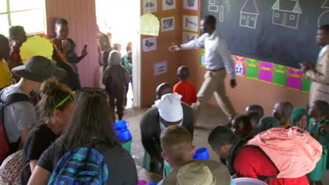 Volunteers-Help-Feed-Hungry-African-Children-at-a-Primary-School-Feeding-Program-in-Rural-Zimbabwe,-Africa