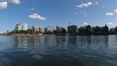 low-aerial-flyby-False-Creek-downtown-Vancouver-Canada-while-motorboating-people-are-enjoying-the-sunny-hot-day-at-the-Olympic-Village-lowrise-buildings-harbor-during-the-Labour-Day-holiday-dingy3-7