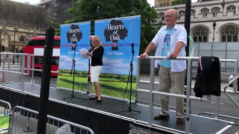 Catherine-Blaiklock-speaks-on-stage-at-an-anti-grooming-event-in-Parliament-Square,-London,-UK