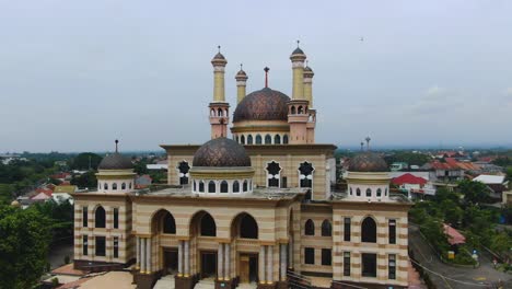 Aerial-view-of-Al-Aqsa-mosque-in-Klaten-Indonesia-with-flock-of-pigeons-flying