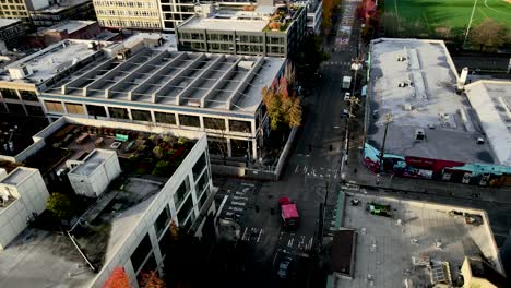 Concrete-blocks,-boarded-up-windows-dominate-the-East-Precinct-of-the-Seattle-Police-Department,-aerial-orbit