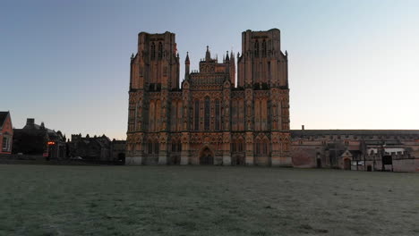 Frosty-morning-aerial-of-the-historic-Wells-Cathedral-in-Somerset,-England