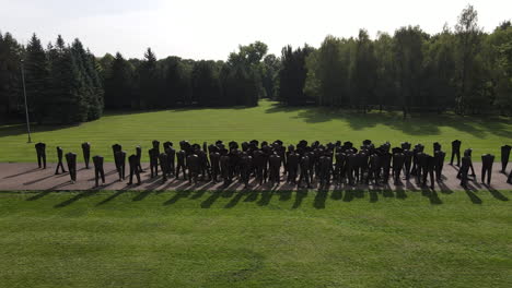 Drone-shot-of-unrecognized-sculptures-at-Cytadela-Park-in-Poland