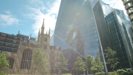 Lockdown-in-London,-empty-streets-in-front-of-The-Scalpel-skyscraper-and-Gherkin-reflection-in-the-financial-district,-during-the-COVID-19-pandemic-2020