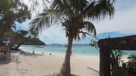 Picturesque-beach-in-Koh-Hey-with-quiet-beachfront-with-floating-pier,-Thailand---Wide-gimbal-reveal-shot