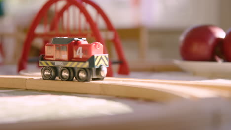 A-single-Brio-locomotive-passes-through-frame-on-a-sunny-table-top