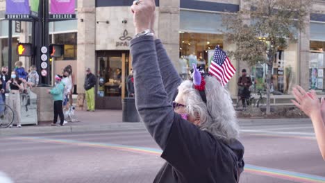 People-celebrating-Joe-Biden's-election-victory-in-the-streets-of-Boulder,-Colorado