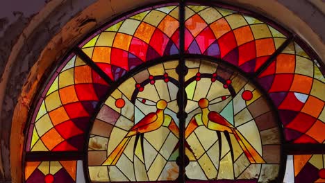 Vibrant-birds-on-stained-glass-inside-Children-Railway-Station,-Yerevan,-Armenia