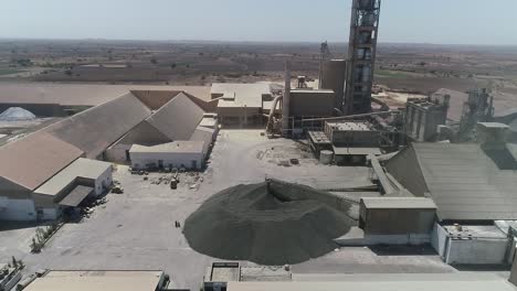 Aerial-drone-view-of-excavator-loading-the-tipper-truck-at-the-construction-site