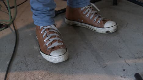 Close-up-of-a-female-guitarists-feet-tapping-on-the-stage-floor