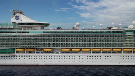 Side-angle-drone-shot-of-cruise-ship-showing-suites-and-life-boats