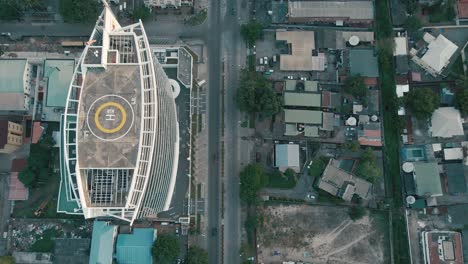 Cityscape-of-residential-buildings,-Helipad,-and-major-roads-during-sunrise