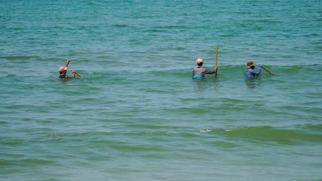 Scene-of-Vietnamese-fishermen-collecting-shells-and-seafood