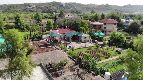 Aerial-Over-Farm-House-With-Allotments-Nearby